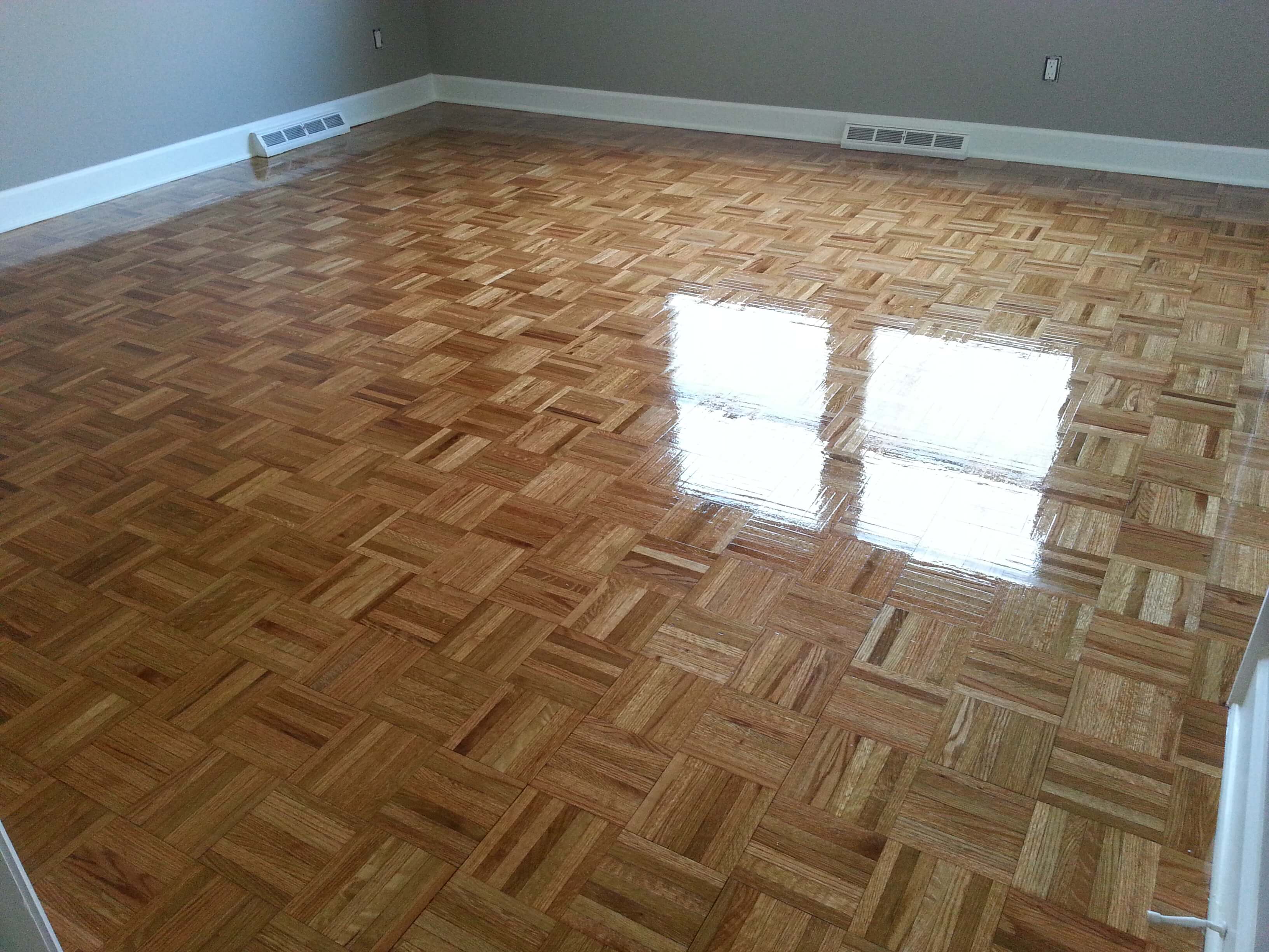 A recently refinished parquet hardwood floor