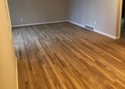 a hardwood floor before being refinished