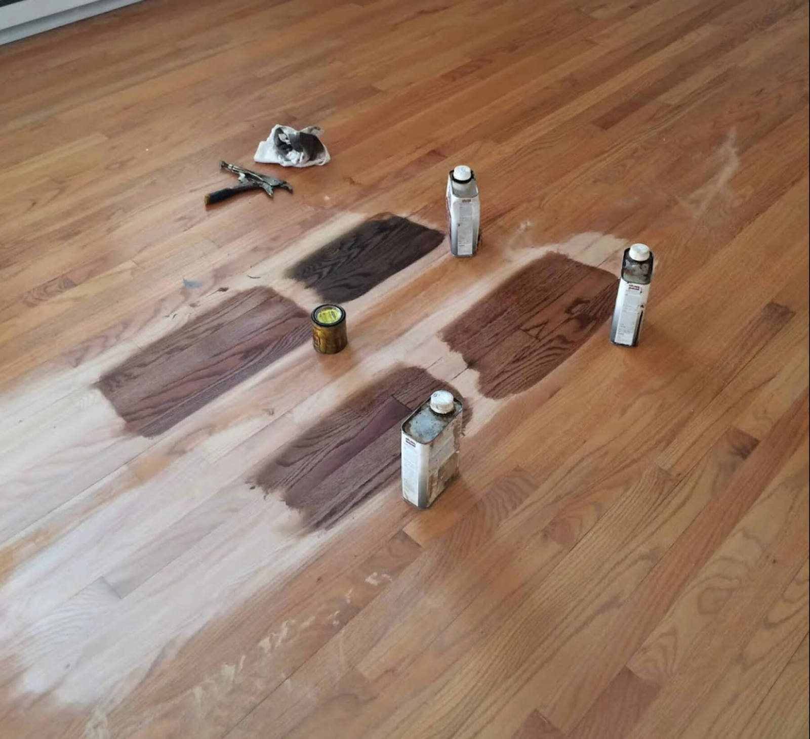different color of stains sampled on a hardwood floor in Atlanta, GA